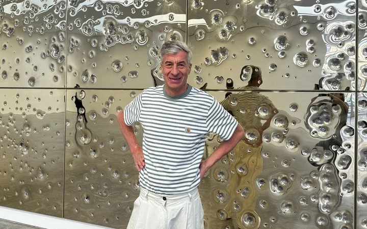 Bullet-Riddled Brilliance: Cattelan's Golden Wall Satire